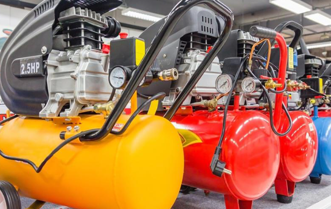 different coloured air compressors in a line
